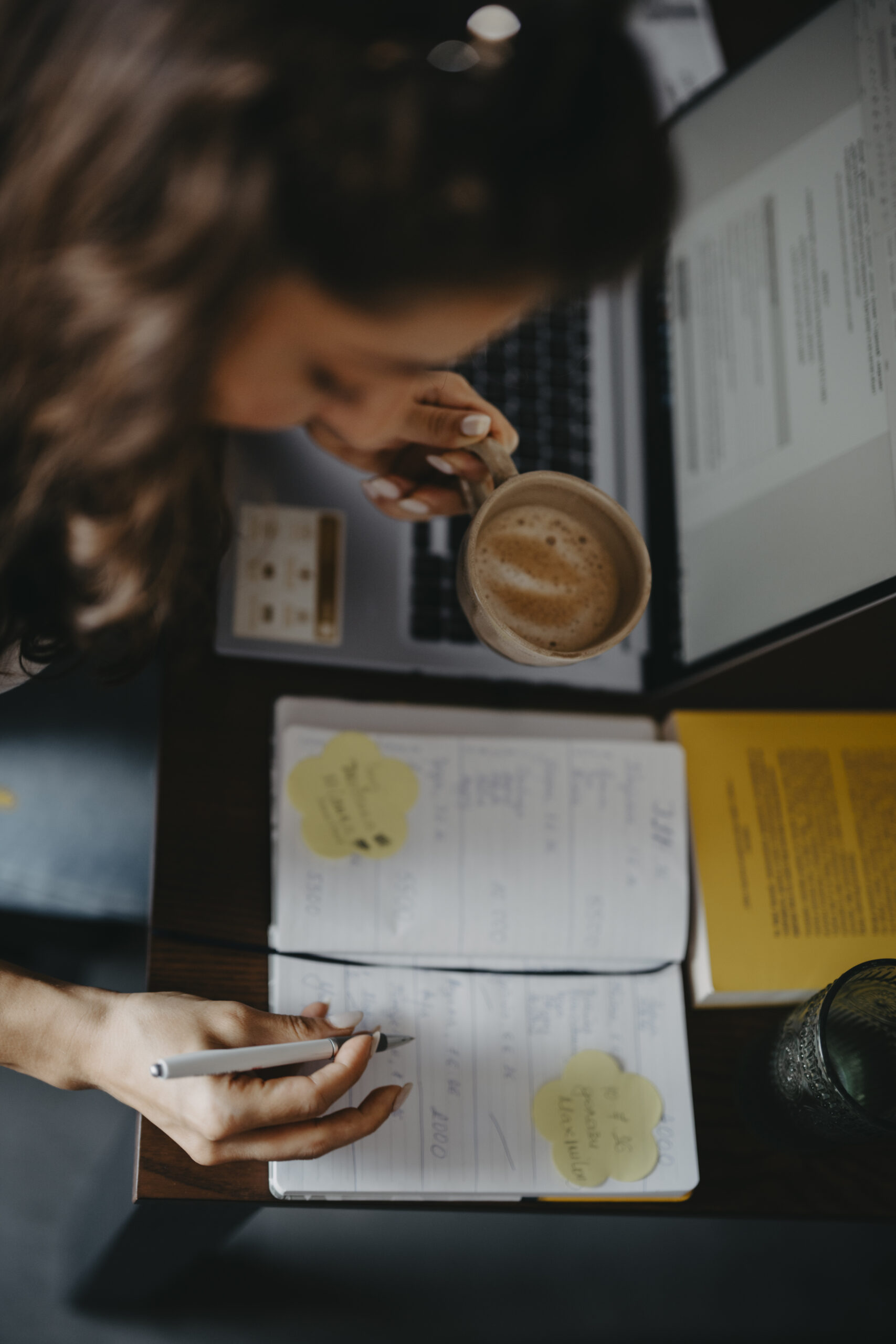 Affiliate marketing beginner planning a content schedule with laptop and coffee