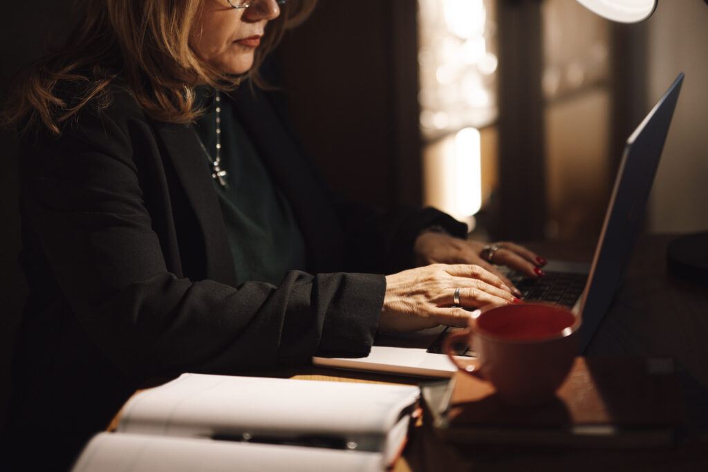 Wealthy Affiliate training: woman typing on a laptop in a home office