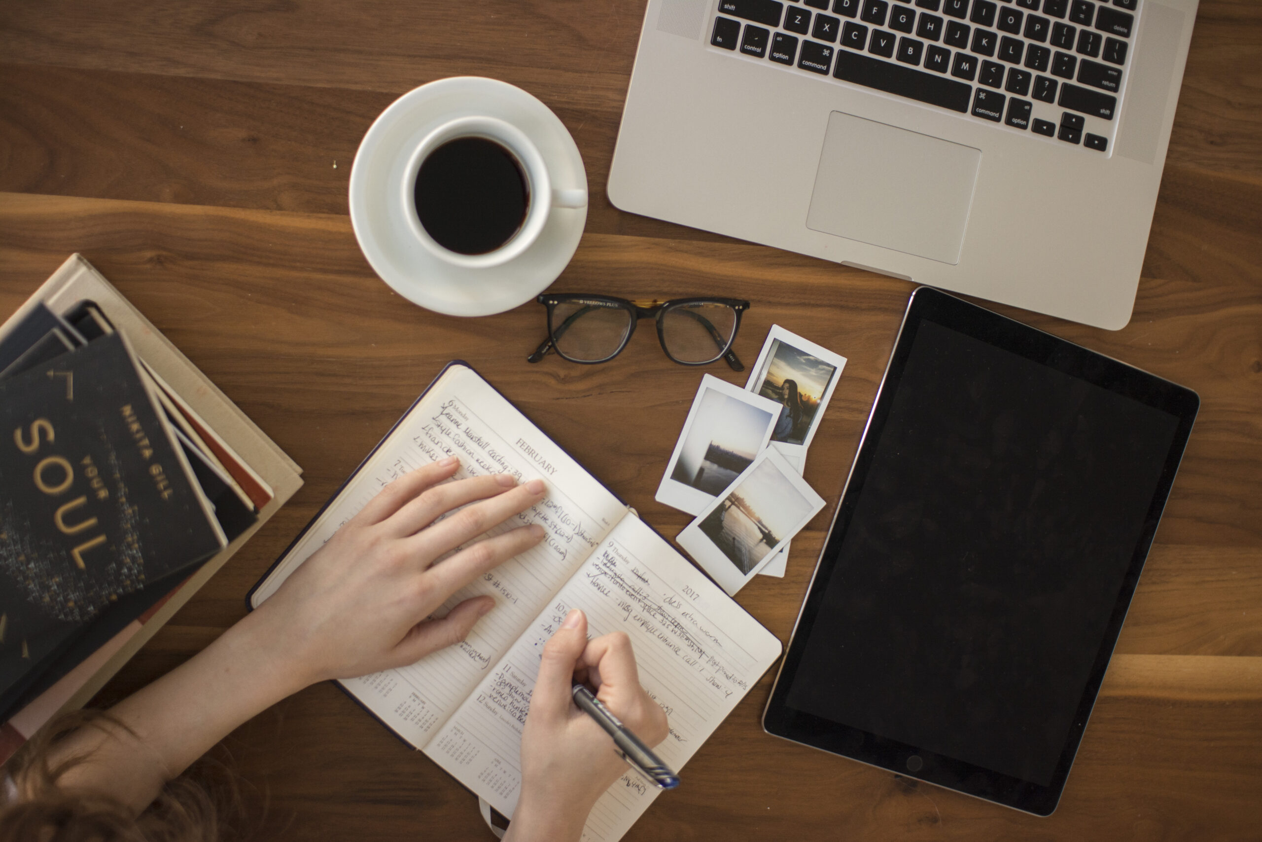 Planning affiliate marketing content topics in a journal over coffee