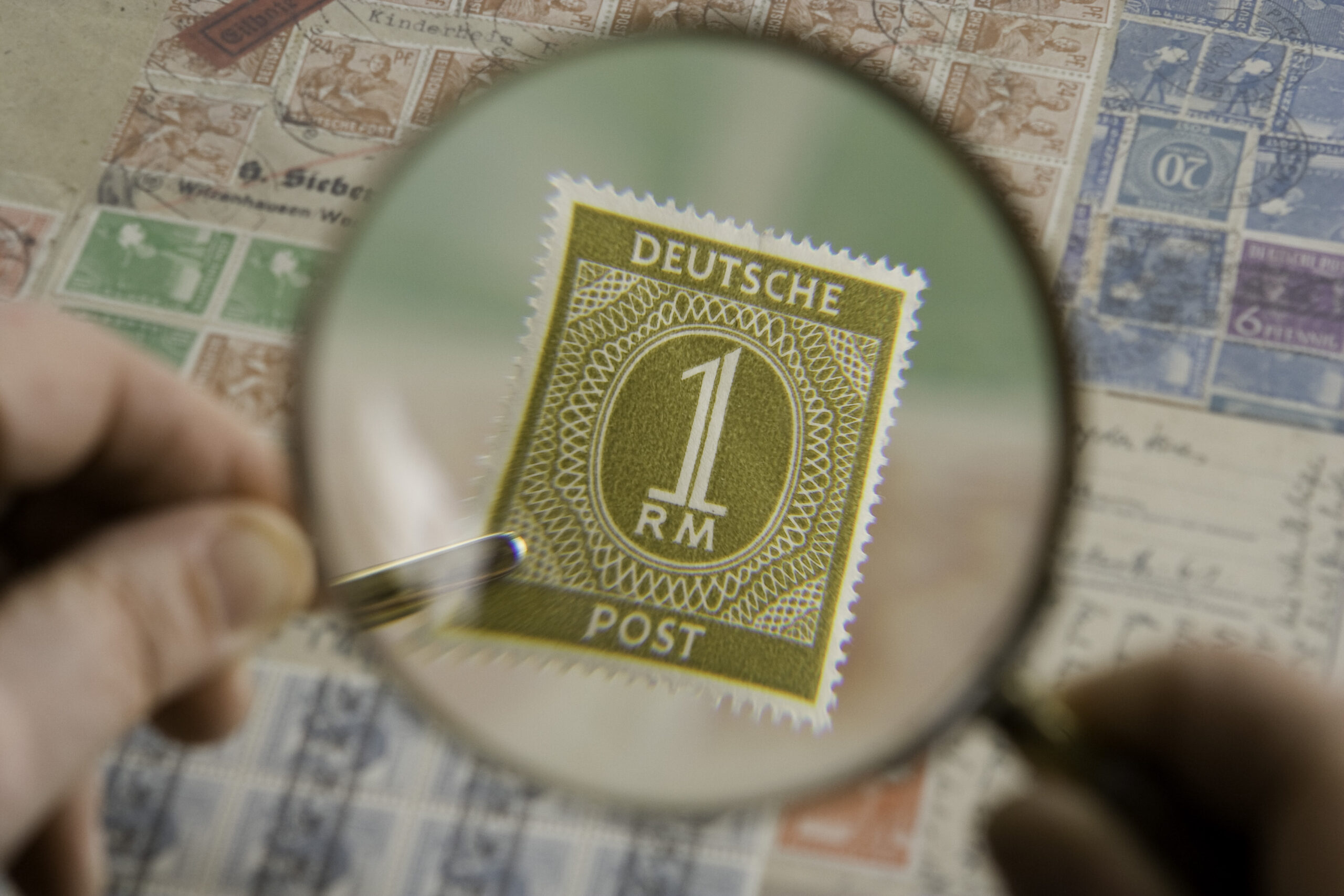 Magnifying glass examining affiliate site analytics and search data