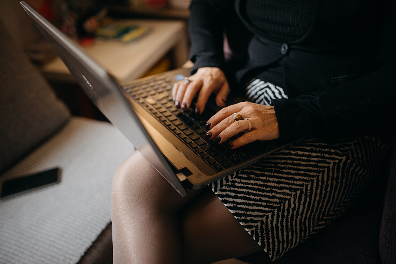 Woman working on a laptop at home